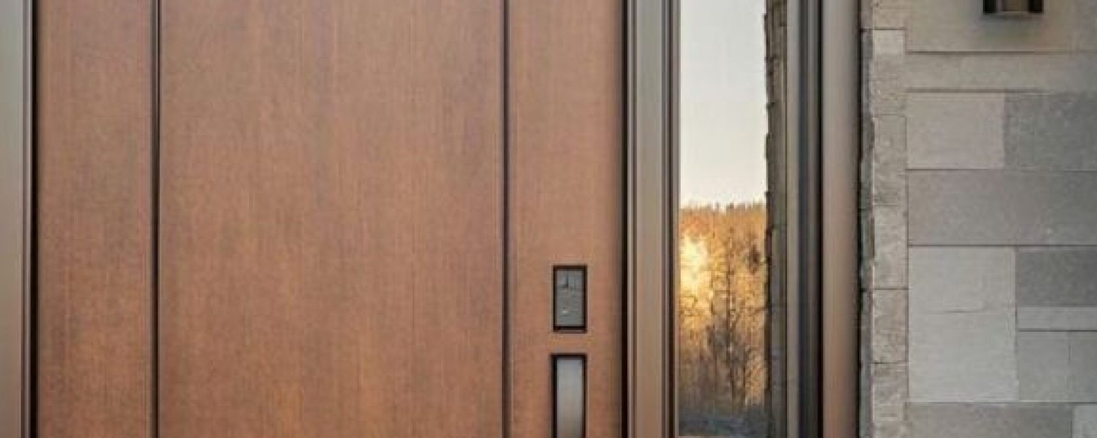Modern wooden entrance door with clean lines reflecting 2025 door design trends
