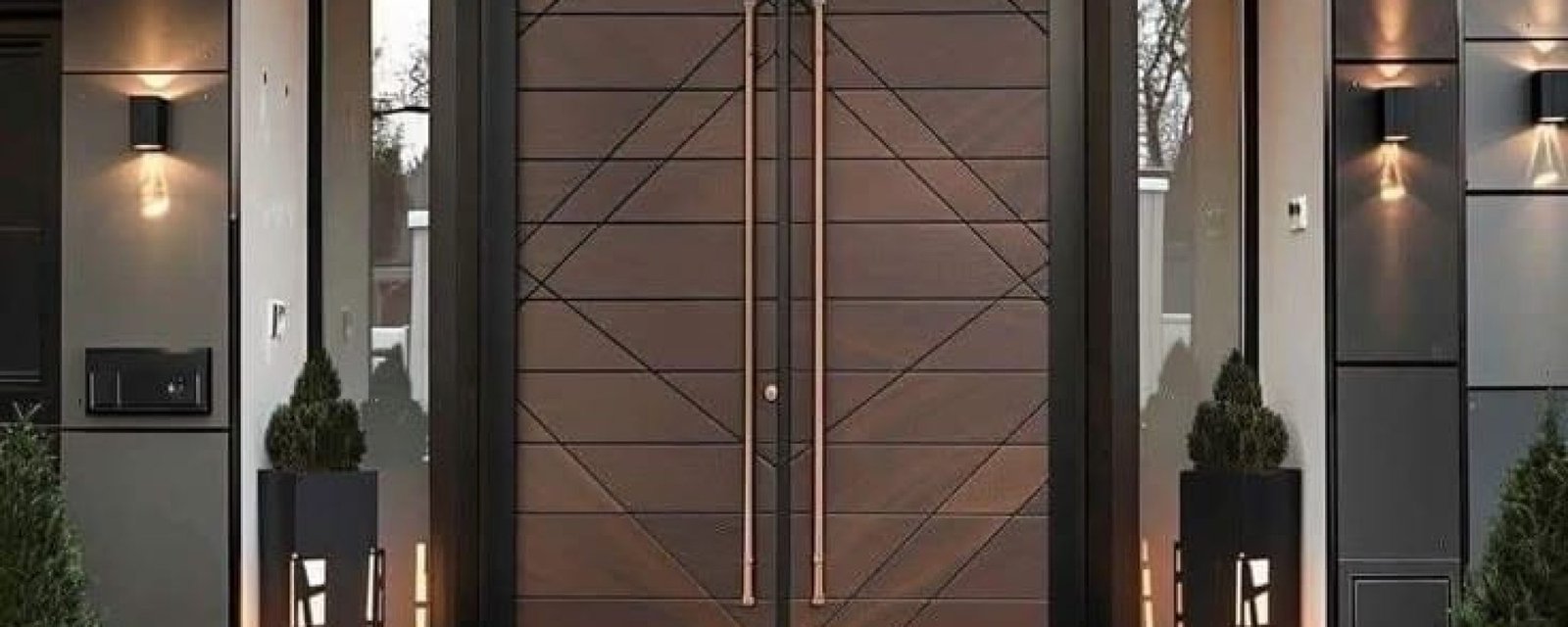 Modern wooden main door with geometric panel design and warm lighting at a residential entrance